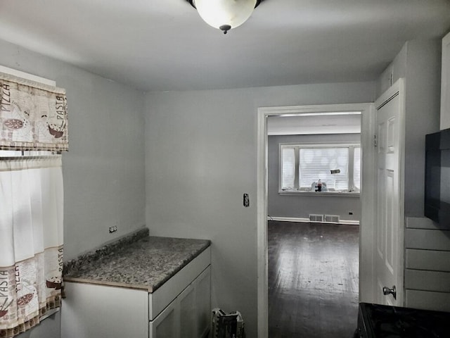 2404 E 97th St, Chicago, IL 60617 - laundry room featuring wood finished floors