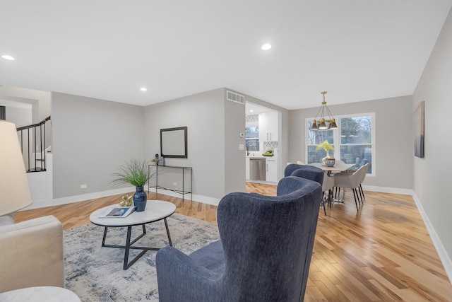 274 University Dr, Buffalo Grove, IL 60089 - living area featuring light wood-style floors, baseboards, stairs, and recessed lighting