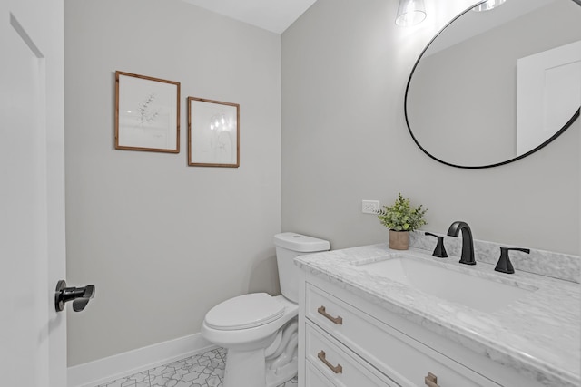 274 University Dr, Buffalo Grove, IL 60089 - bathroom with vanity, toilet, and baseboards