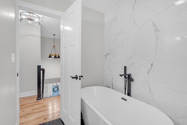 274 University Dr, Buffalo Grove, IL 60089 - bathroom featuring a freestanding bath and wood finished floors