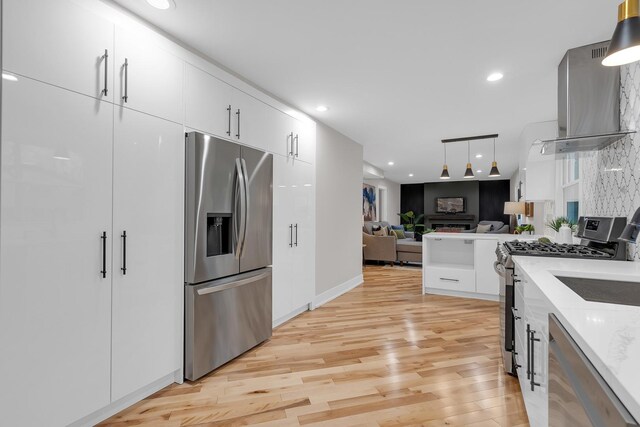 274 University Dr, Buffalo Grove, IL 60089 - kitchen with appliances with stainless steel finishes, white cabinets, light wood-type flooring, open floor plan, and pendant lighting