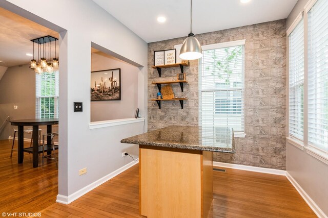 773 Pheasant Trl Unit 773, Saint Charles, IL 60174 - indoor wet bar featuring baseboards, wood finished floors, plenty of natural light, a chandelier, and recessed lighting