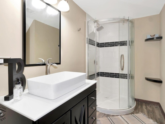 14802 Anne Ct, Oak Forest, IL 60452 - bathroom with vanity, a shower stall, wood finished floors, and baseboards