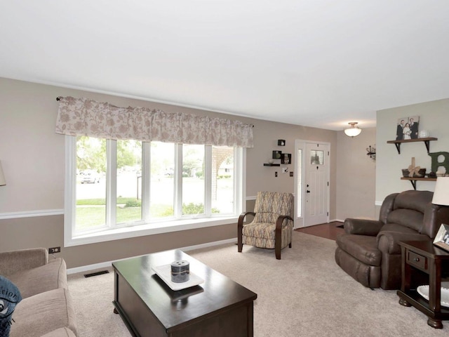 14802 Anne Ct, Oak Forest, IL 60452 - carpeted living area featuring healthy amount of natural light and baseboards