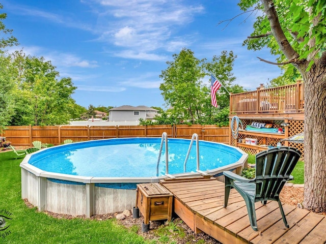 14802 Anne Ct, Oak Forest, IL 60452 - view of swimming pool featuring a wooden deck and a fenced backyard