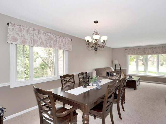 14802 Anne Ct, Oak Forest, IL 60452 - dining area with light colored carpet, a chandelier, and baseboards