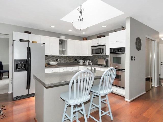 14802 Anne Ct, Oak Forest, IL 60452 - kitchen with appliances with stainless steel finishes, a sink, dark wood-style flooring, backsplash, and recessed lighting