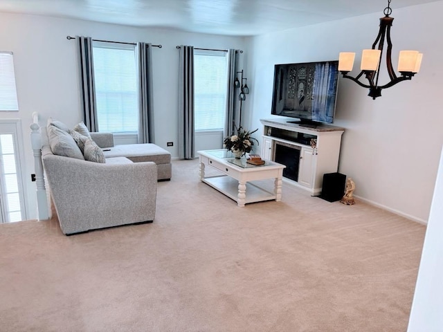 915 Manchester Cir, Grayslake, IL 60030 - living room featuring a chandelier, light carpet, and baseboards