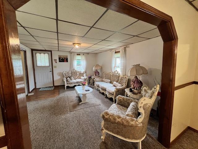 520 W American St, Freeport, IL 61032 - living area with a paneled ceiling, plenty of natural light, and baseboards
