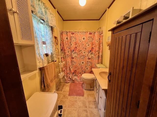 520 W American St, Freeport, IL 61032 - full bath with toilet, vanity, tile patterned floors, ornamental molding, and a shower with shower curtain