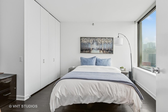 501 N Clinton St Unit 1804, Chicago, IL 60654 - bedroom featuring dark wood-type flooring and a closet