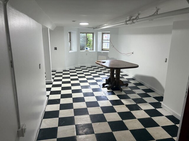 1530 N Springfield Ave, Chicago, IL 60651 - below grade area with tile patterned floors and baseboards