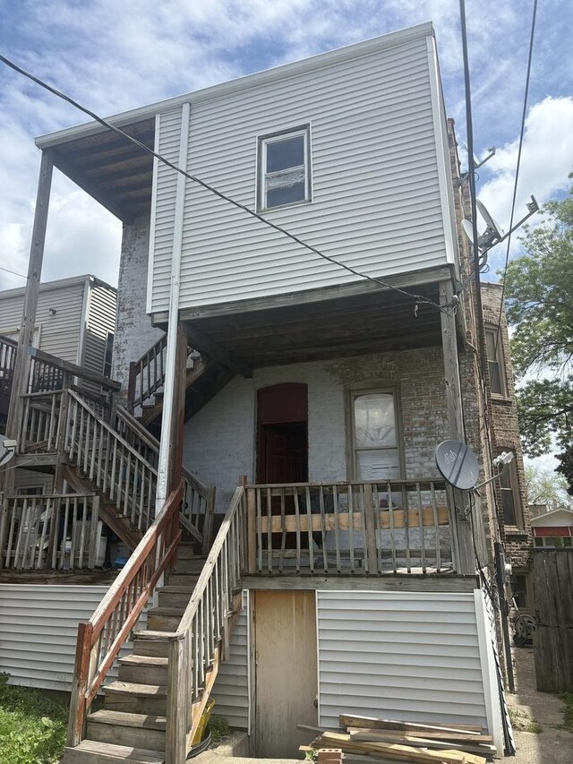 1530 N Springfield Ave, Chicago, IL 60651 - view of front of property with stairs, covered porch, and brick siding