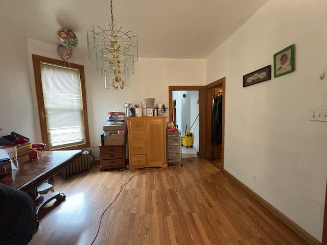 1530 N Springfield Ave, Chicago, IL 60651 - office space featuring light wood-type flooring and a chandelier