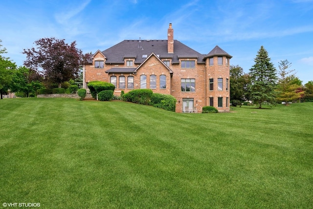 26 Forest Ln, South Barrington, IL 60010 - rear view of property with a chimney, a lawn, and brick siding
