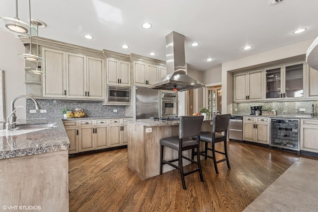 26 Forest Ln, South Barrington, IL 60010 - kitchen with island exhaust hood, stainless steel appliances, beverage cooler, tasteful backsplash, and dark wood-style flooring