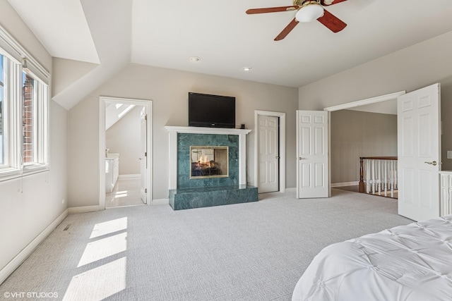 26 Forest Ln, South Barrington, IL 60010 - carpeted bedroom featuring lofted ceiling, a fireplace, connected bathroom, and ceiling fan