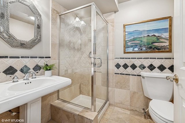 26 Forest Ln, South Barrington, IL 60010 - bathroom featuring tile walls, a stall shower, and a wainscoted wall