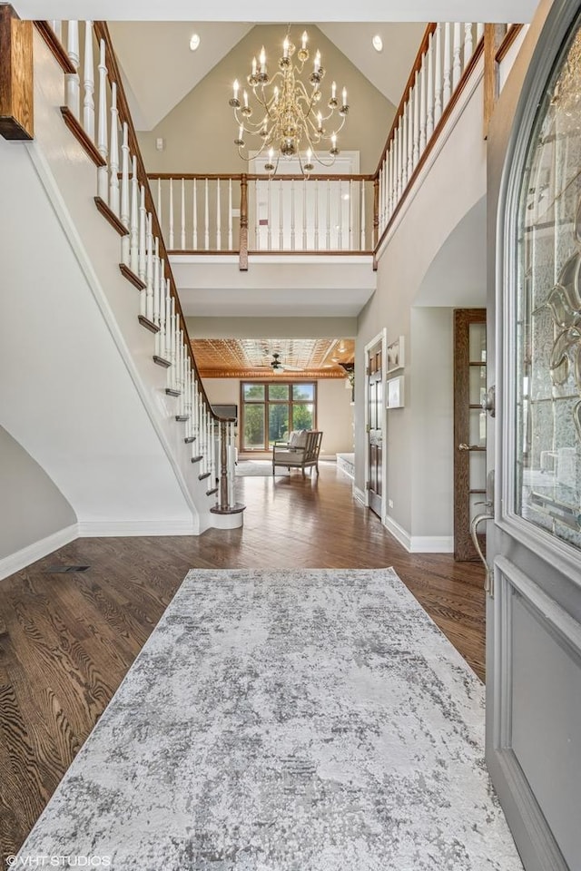 26 Forest Ln, South Barrington, IL 60010 - foyer entrance with wood finished floors, high vaulted ceiling, stairway, a chandelier, and recessed lighting
