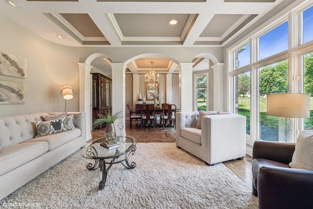 26 Forest Ln, South Barrington, IL 60010 - living area with decorative columns, coffered ceiling, crown molding, wood finished floors, and arched walkways