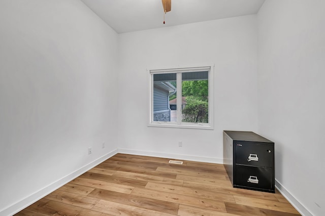 405 S Carol Ln, Braidwood, IL 60408 - unfurnished room with light wood finished floors, a ceiling fan, and baseboards