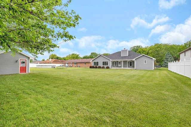 405 S Carol Ln, Braidwood, IL 60408 - back of house with a chimney and roof with shingles