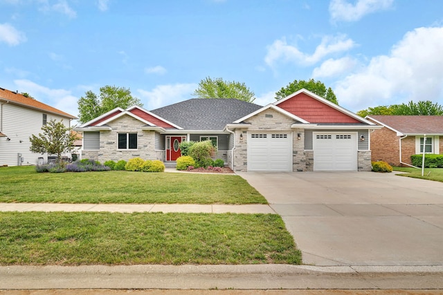 405 S Carol Ln, Braidwood, IL 60408 - craftsman-style home with stone siding, an attached garage, concrete driveway, and a front yard