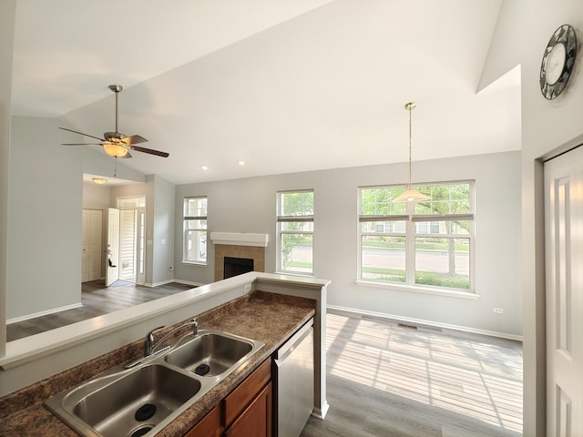 1931 Chase Ln Unit 1931, Aurora, IL 60502 - kitchen featuring dishwasher, a sink, open floor plan, ceiling fan, and baseboards