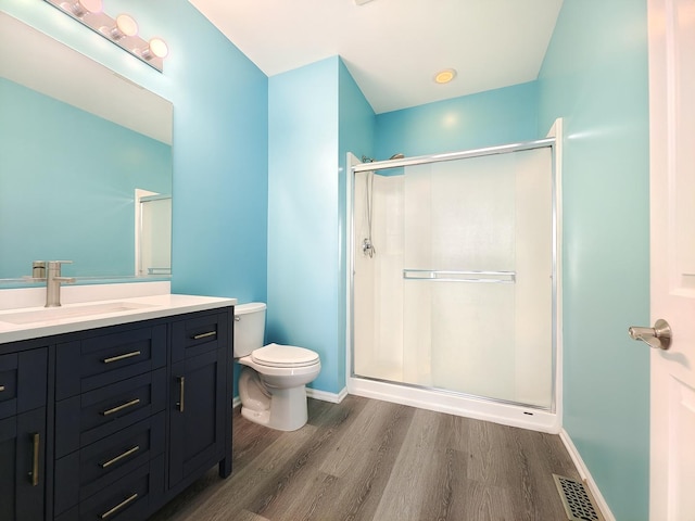 1931 Chase Ln Unit 1931, Aurora, IL 60502 - full bathroom with wood finished floors, toilet, vanity, and a shower stall