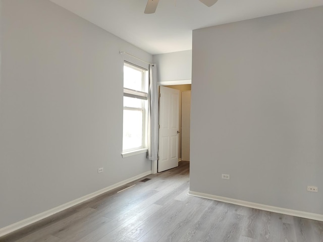 1931 Chase Ln Unit 1931, Aurora, IL 60502 - unfurnished room featuring a ceiling fan, light wood-style flooring, and baseboards
