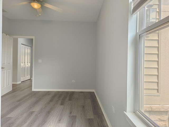1931 Chase Ln Unit 1931, Aurora, IL 60502 - unfurnished room featuring wood finished floors, ceiling fan, and plenty of natural light