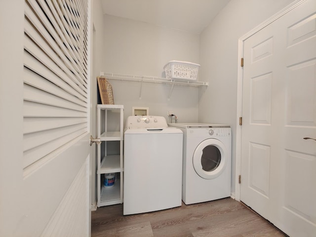 1931 Chase Ln Unit 1931, Aurora, IL 60502 - laundry room featuring washer and dryer and wood finished floors