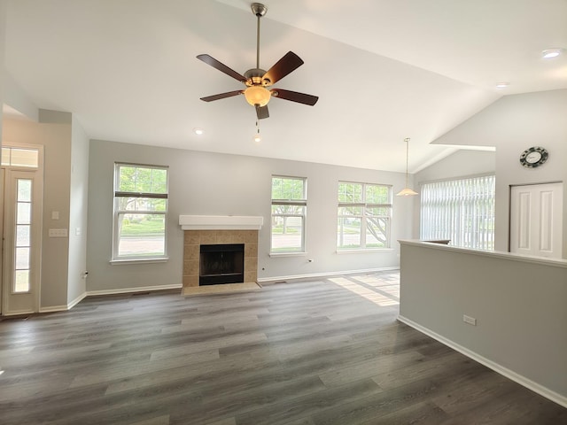 1931 Chase Ln Unit 1931, Aurora, IL 60502 - unfurnished living room featuring lofted ceiling, healthy amount of natural light, dark wood finished floors, ceiling fan, and baseboards