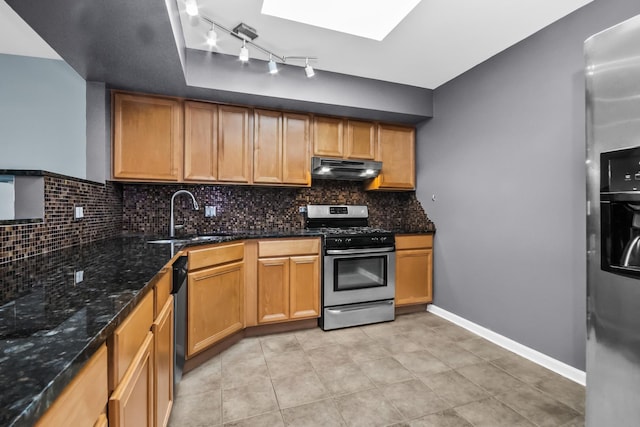 7200 N Ridge Blvd Unit 4H, Chicago, IL 60645 - kitchen with appliances with stainless steel finishes, exhaust hood, decorative backsplash, rail lighting, and light tile patterned floors