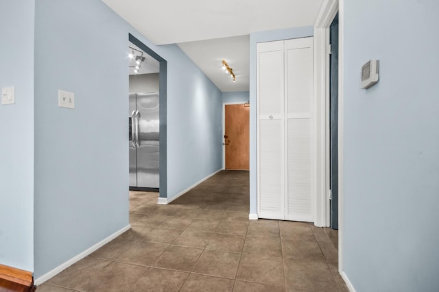 7200 N Ridge Blvd Unit 4H, Chicago, IL 60645 - corridor featuring rail lighting and tile patterned flooring