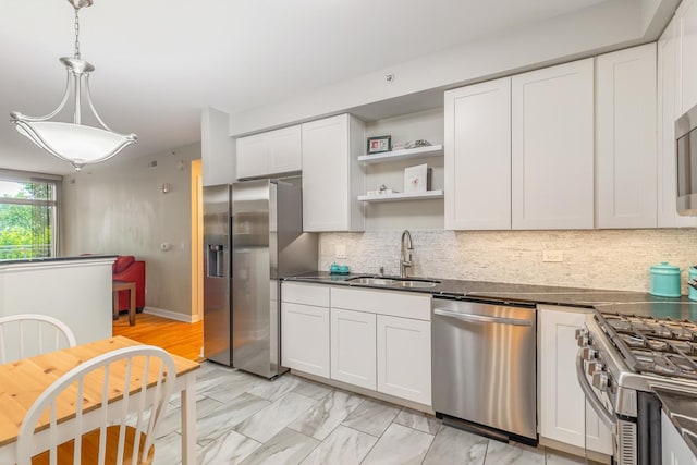 8340 Callie Ave Unit 105, Morton Grove, IL 60053 - kitchen featuring appliances with stainless steel finishes, dark countertops, white cabinets, and open shelves
