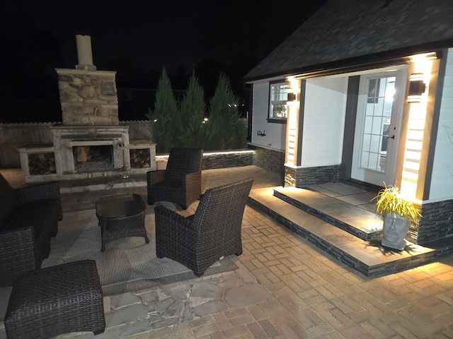 7225 Poplar Ln, Darien, IL 60561 - patio at twilight featuring an outdoor stone fireplace and a patio area