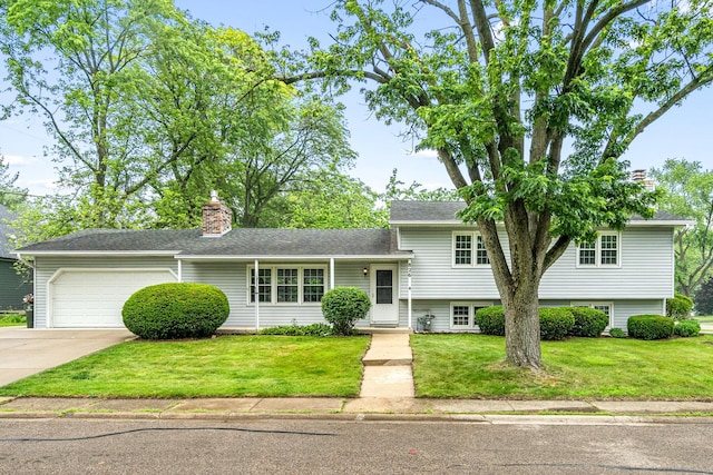 826 Iris Ln, Naperville, IL 60540 - tri-level home featuring a chimney, a garage, a front yard, and driveway