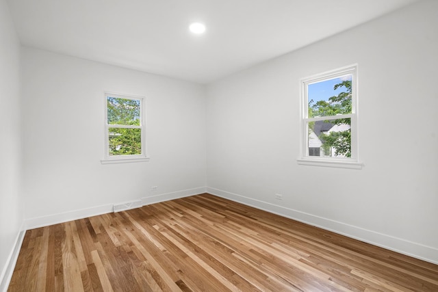 826 Iris Ln, Naperville, IL 60540 - empty room featuring light wood-type flooring and recessed lighting