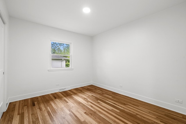 826 Iris Ln, Naperville, IL 60540 - unfurnished room with baseboards and wood finished floors