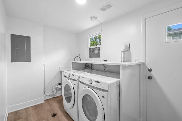 826 Iris Ln, Naperville, IL 60540 - laundry room with electric panel, washer and clothes dryer, and light wood-type flooring