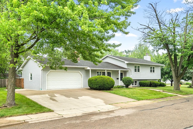 826 Iris Ln, Naperville, IL 60540 - tri-level home with a chimney, a garage, driveway, and a shingled roof