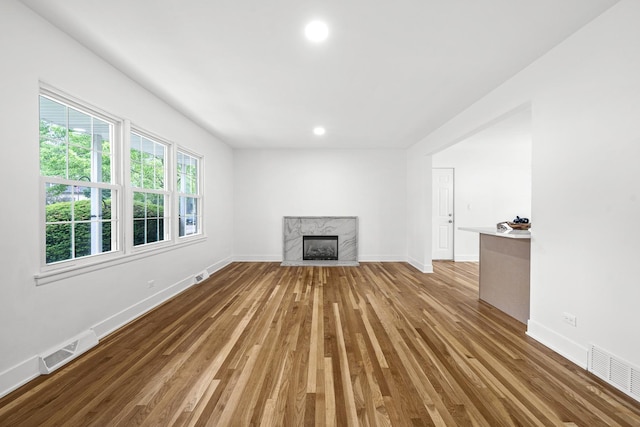826 Iris Ln, Naperville, IL 60540 - unfurnished living room with wood finished floors, recessed lighting, and a high end fireplace