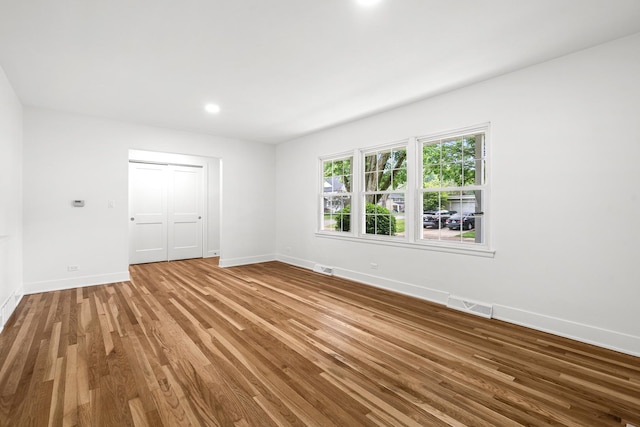 826 Iris Ln, Naperville, IL 60540 - spare room with wood finished floors and recessed lighting