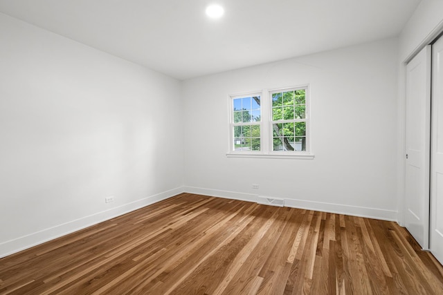 826 Iris Ln, Naperville, IL 60540 - unfurnished bedroom with wood finished floors and a closet