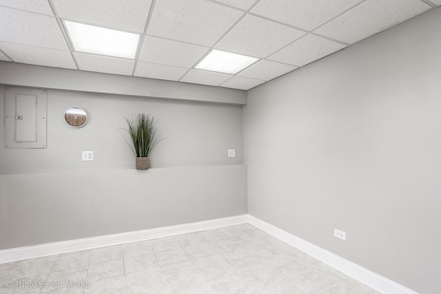 1406 Edgefield Ln, Hoffman Estates, IL 60169 - tiled empty room featuring electric panel, a drop ceiling, and baseboards