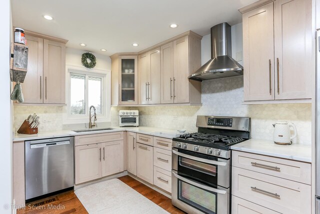 1406 Edgefield Ln, Hoffman Estates, IL 60169 - kitchen featuring stainless steel appliances, wall chimney exhaust hood, a sink, light countertops, and recessed lighting