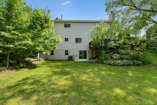 530 Old Oak Cir, Algonquin, IL 60102 - back of house featuring a chimney, a lawn, and central AC
