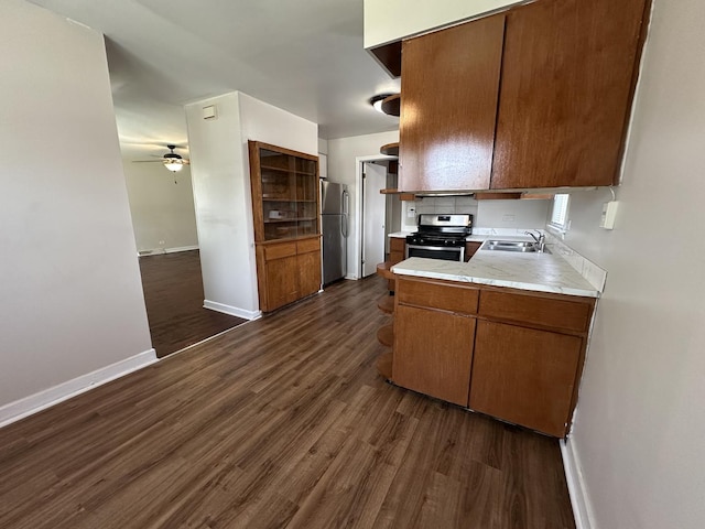 14631 Michigan Ave, Dolton, IL 60419 - kitchen with appliances with stainless steel finishes, a sink, ceiling fan, baseboards, and dark wood-style flooring