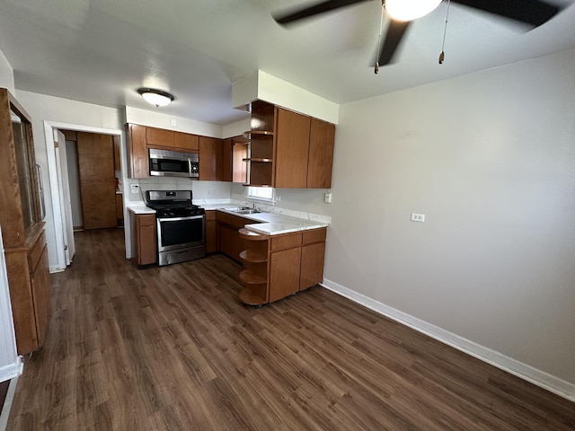 14631 Michigan Ave, Dolton, IL 60419 - kitchen featuring open shelves, stainless steel appliances, light countertops, dark wood-type flooring, and baseboards